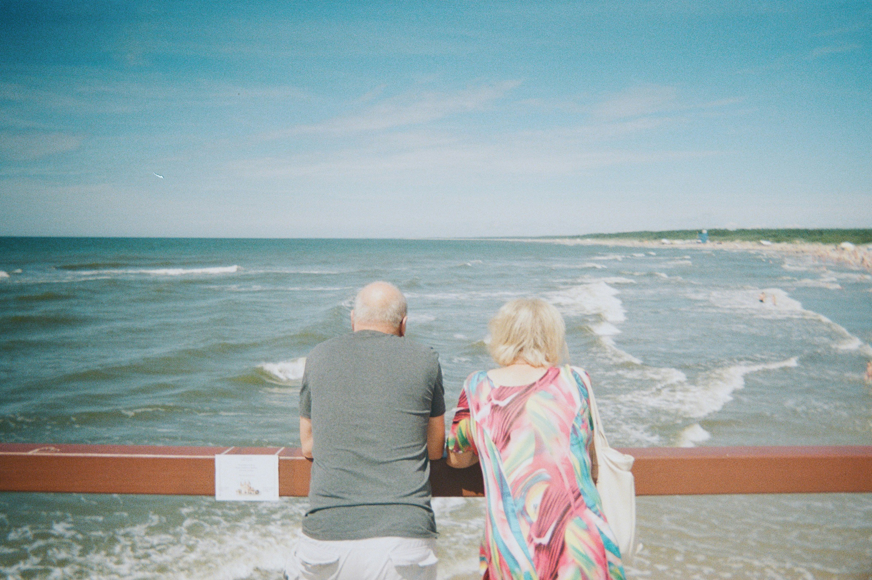 Adult son with his elderly parents, smiling together